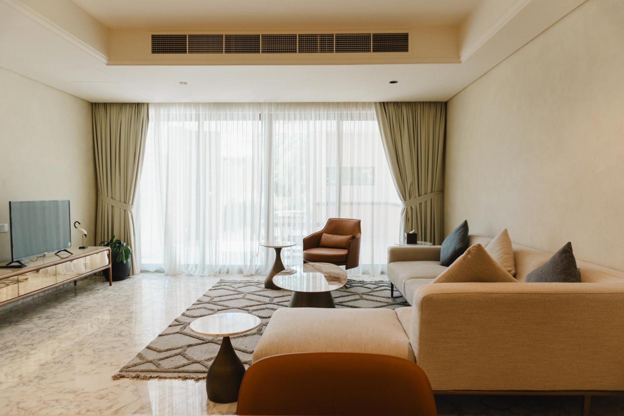 Palavra Resort Manama Eksteriør bilde A living room in a condominium